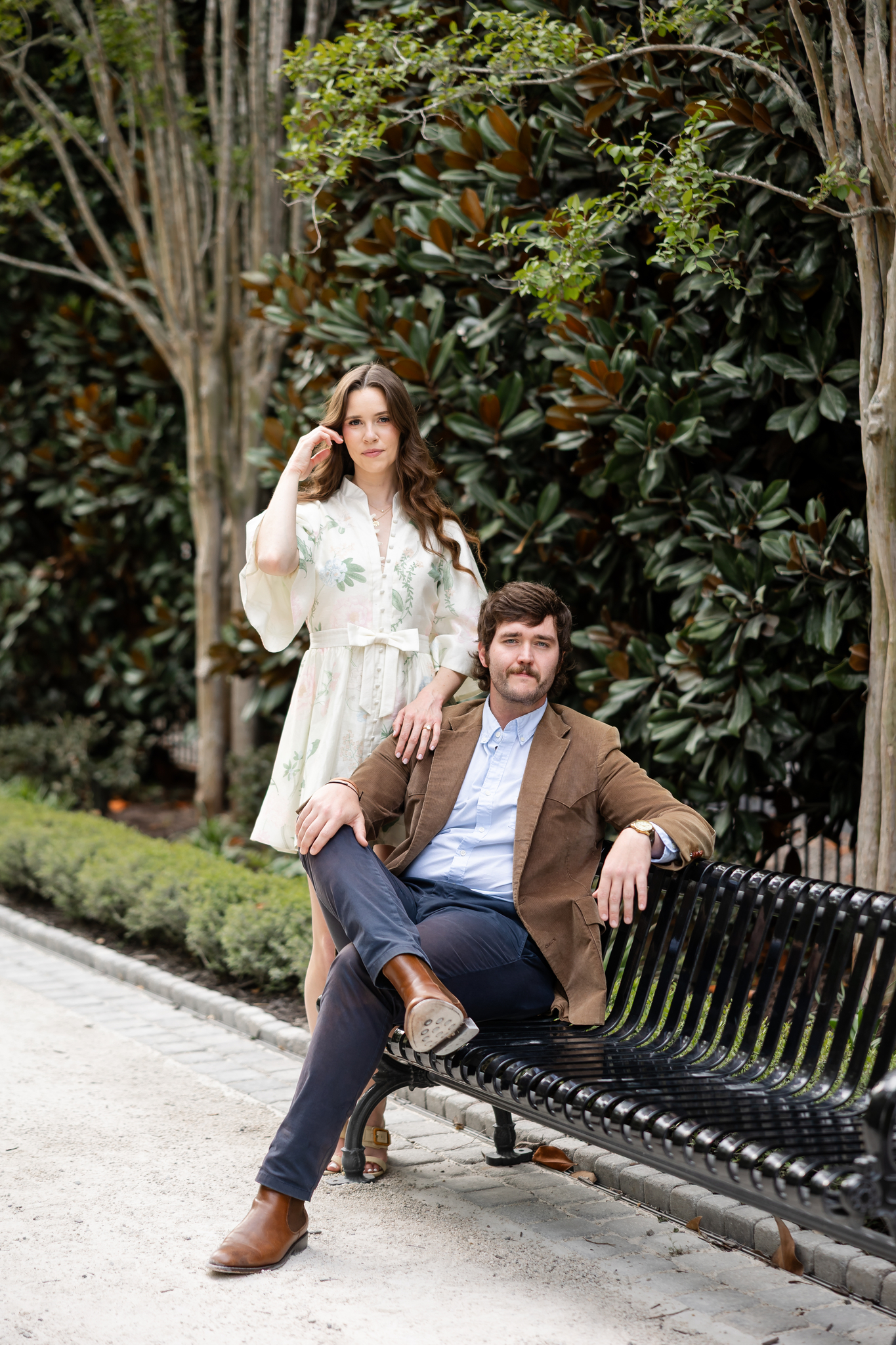 engagement session in charleston in gardens with magnolias
